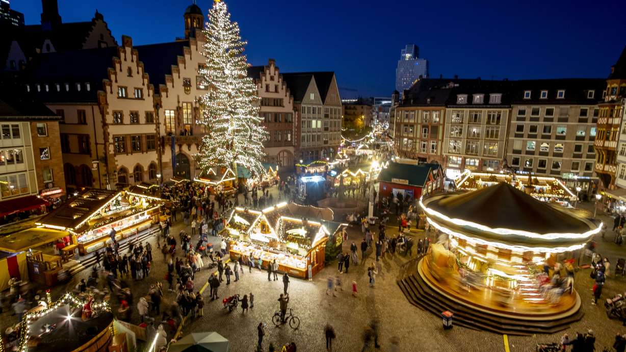 Lights illuminate the Christmas market in Frankfurt, Germany, on Nov. 22. Despite the pandemic inconveniences, stall owners selling ornaments, roasted chestnuts and other holiday-themed items in Frankfurt and other European cities are relieved to be open at all for their first Christmas market in two years.