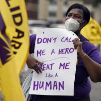 Who's a hero? Some states, cities still debating hazard pay