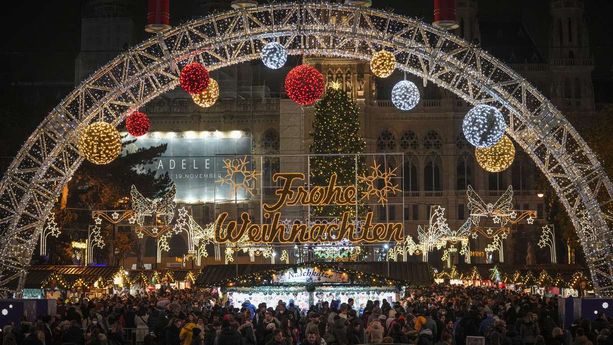 People crowd a Christmas market in Vienna, Austria, Nov. 21, 2021.