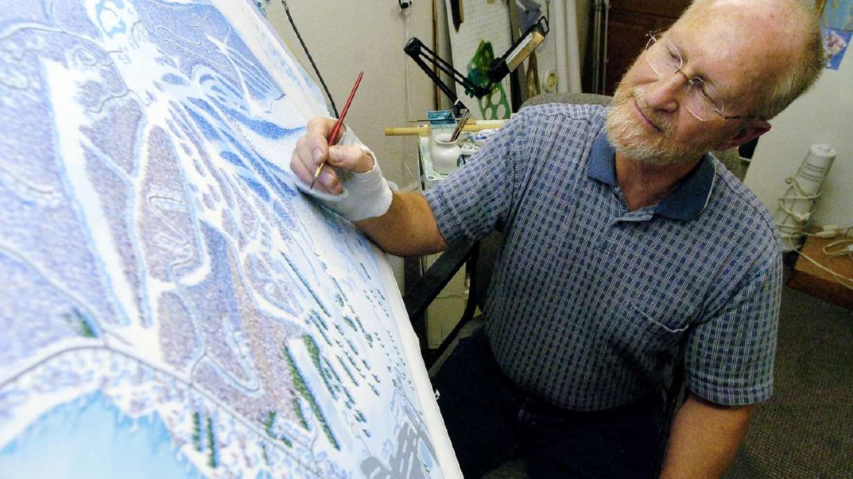 James Niehues works on a ski map of the Wisp Resort in Maryland on Oct. 25, 2007, in Loveland, Colo.