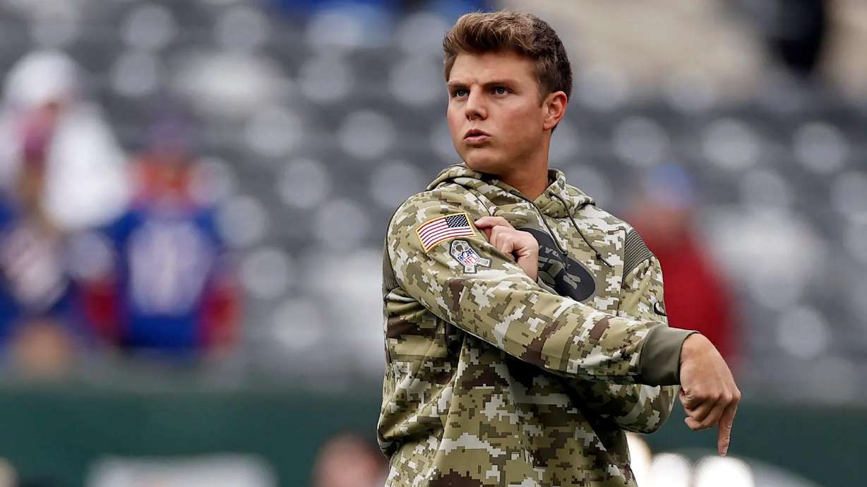 New York Jets quarterback Zach Wilson warms up before a game against the Buffalo Bills, Sunday, Nov. 14, in East Rutherford, N.J.