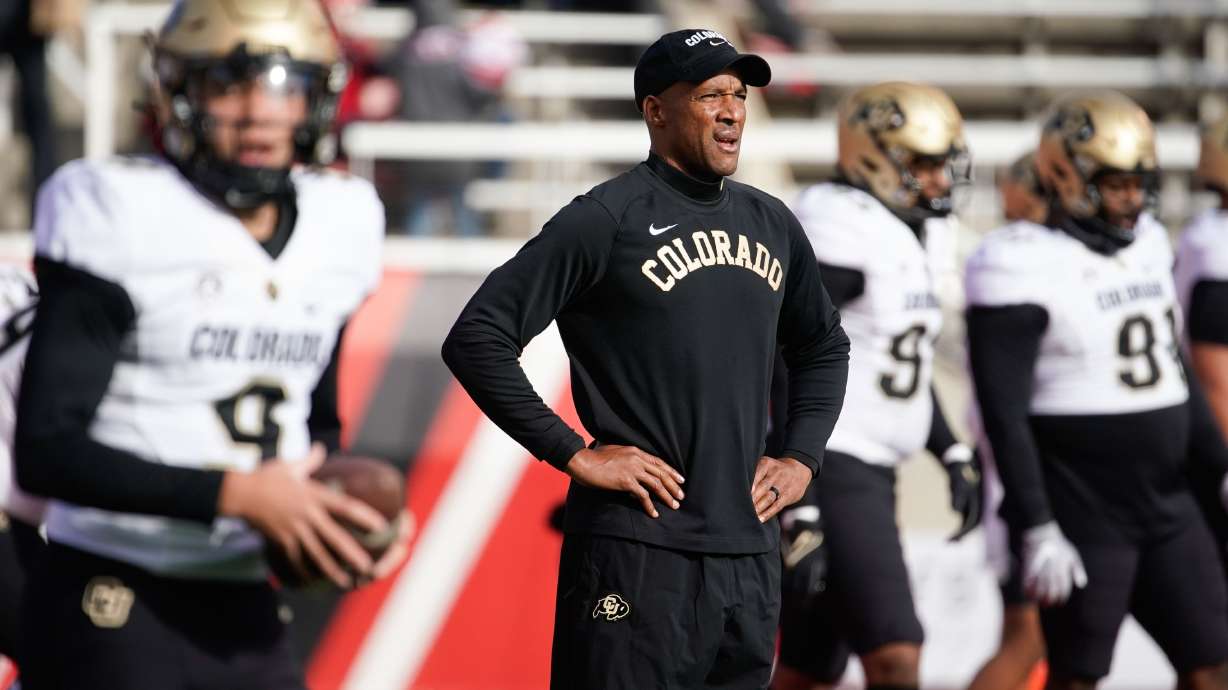 Colorado head coach Karl Dorrell watches during warm-up ahead an NCAA football game against Utah at Rice-Eccles Stadium in Salt Lake City on Friday, Nov. 26, 2021.