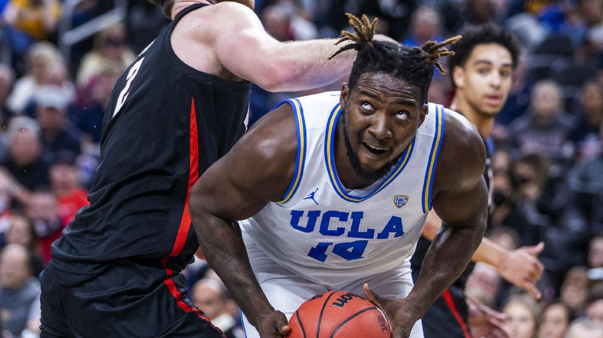 UCLA forward Kenneth Nwuba (14) looks to shoot while Gonzaga forward Drew Timme (2) defends during the first half of an NCAA college basketball game Tuesday, Nov. 23, 2021, in Las Vegas.