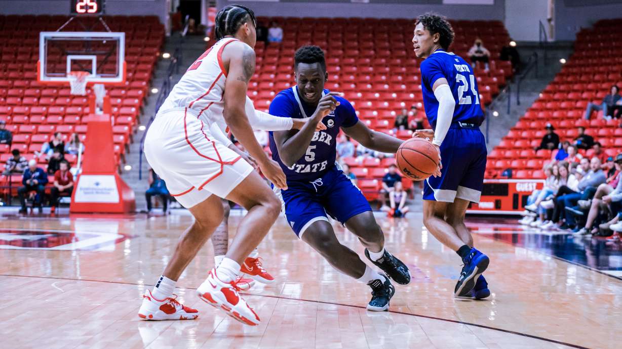 Seikou Sisoho Jawara drive past defender in Weber State's 87-70 win over Dixie State, Nov. 27.