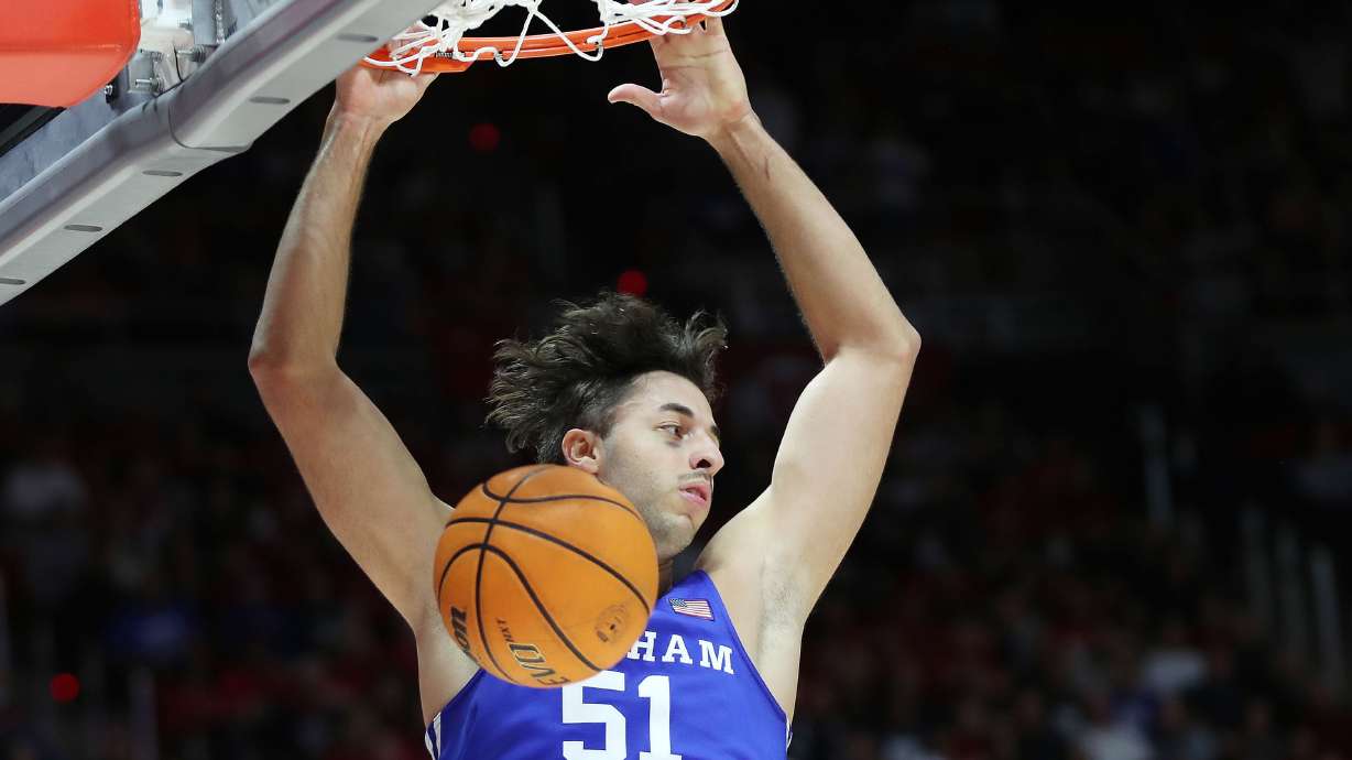 Brigham Young Cougars forward Gavin Baxter (51) dunks in Salt Lake City on Saturday, Nov. 27, 2021. BYU won 75-64.