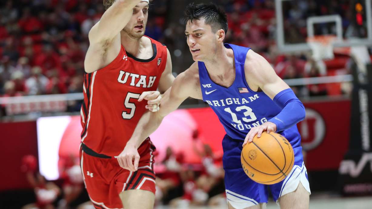 Brigham Young Cougars guard Alex Barcello (13) and Utah Utes guard Jaxon Brenchley (5) compete in Salt Lake City on Saturday, Nov. 27, 2021. BYU won 75-64.