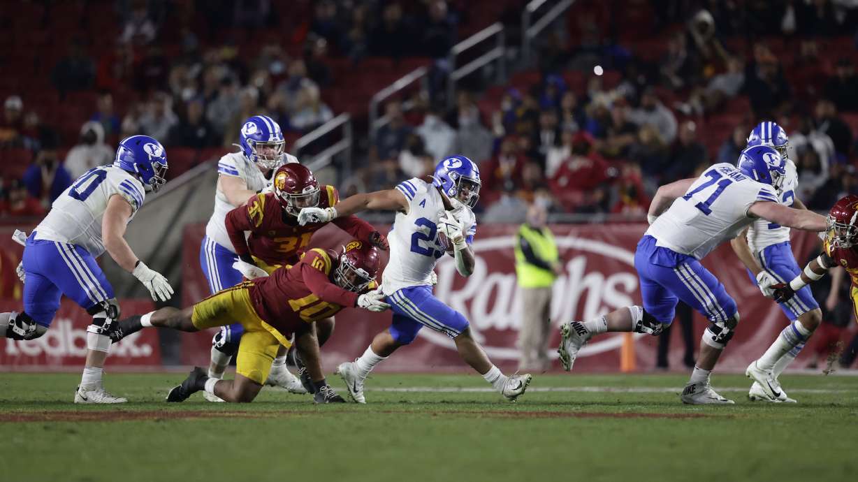 BYU running back Tyler Allgeier runs for yardage against USC during an NCAA college football game, Saturday, Nov. 27, 2021 in the Los Angeles Memorial Coliseum.