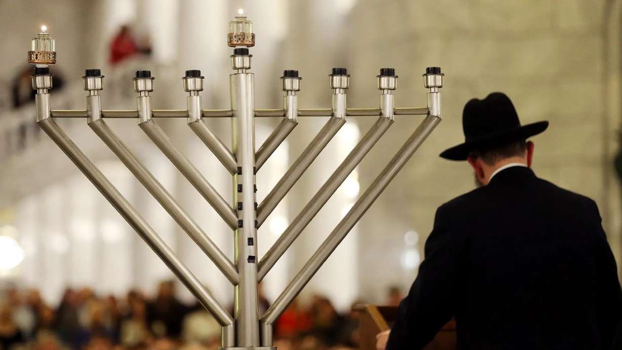 Rabbi Benny Zippel of Chabad Lubavitch of Utah conducts a Hanukkah ceremony in the state Capitol rotunda in Salt Lake City On Dec. 22, 2019.