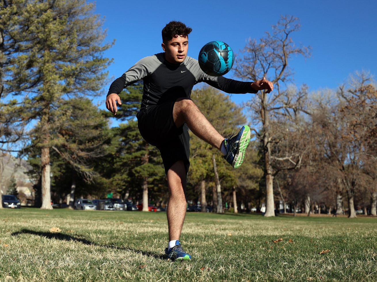 Mohammad Tamim Solhadost, a recent refugee from Afghanistan, goes through a short workout at Liberty Park in Salt Lake City on Wednesday, Nov. 17. He hopes to pursue a professional soccer career.