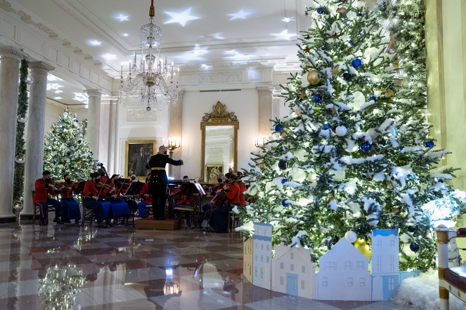 A Marine band plays Christmas music in the Grand Foyer of the White House during a press preview of the White House holiday decorations, Monday in Washington.