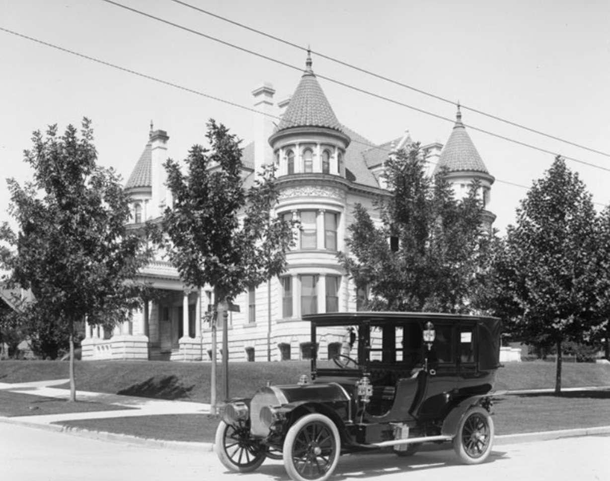 An automobile owned by the Kearns family parked outside of the Kearns Mansion on July 29, 1907.