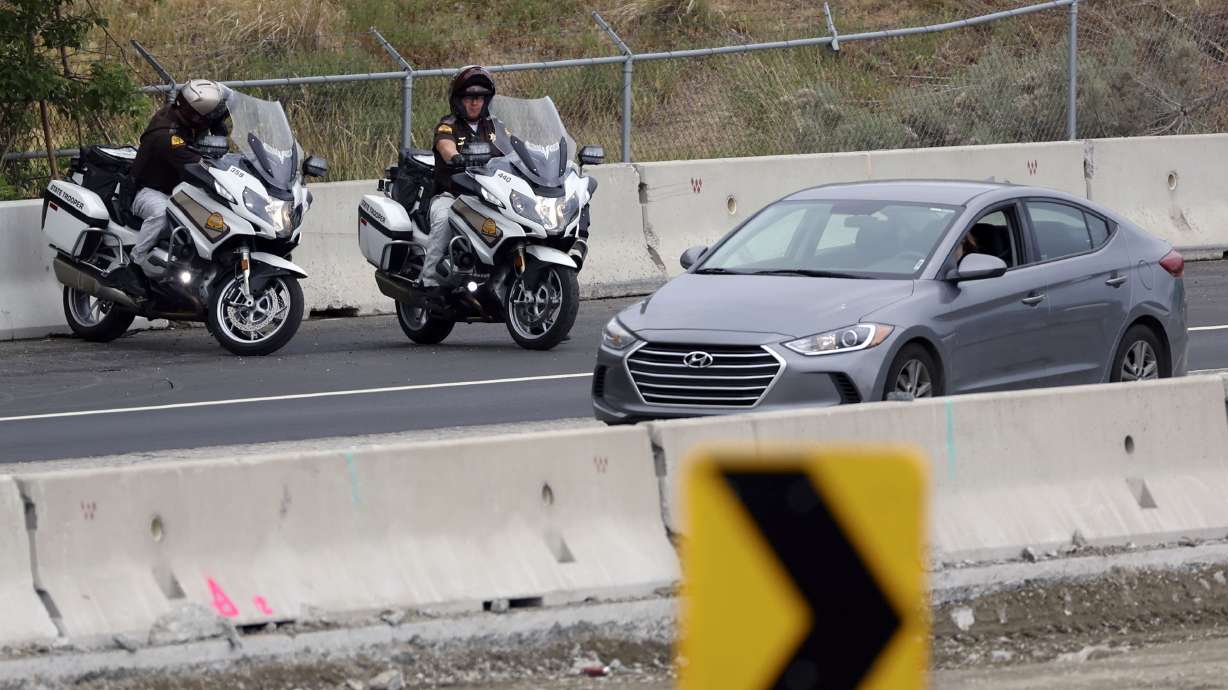 Utah Highway Patrol troopers enforce the speed limit in a construction zone on I-80 near 1700 East in Salt Lake City on June 24. Part of the newly passed Infrastructure Investment and Jobs Act is a mandate that requires DUI monitoring devices to be built into all new cars beginning in 2026.
