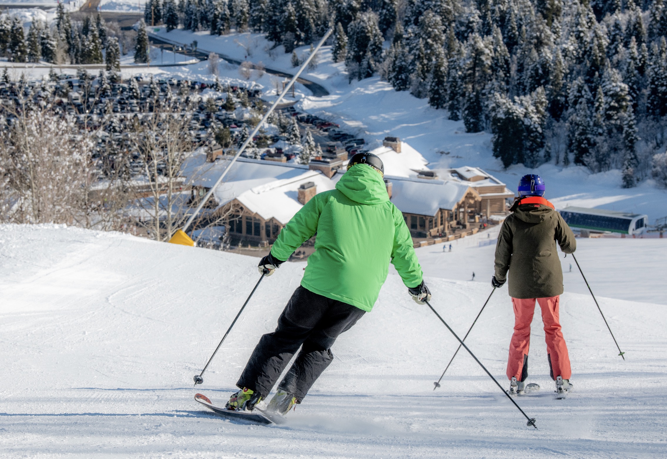 Skiers slide down a slope at Snowbasin Resort. Club Med revealed some new details about the a new resort planned there for 2024. 