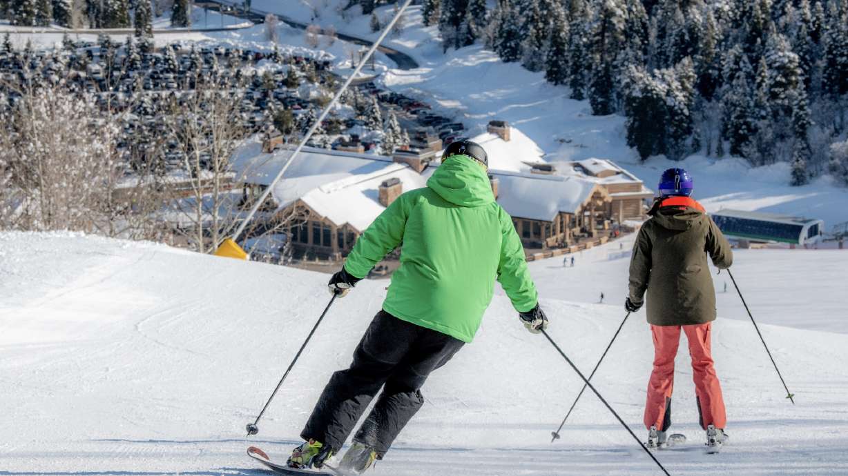 Skiers slide down a slope at Snowbasin Resort. Club Med revealed some new details about the a new resort planned there for 2024.