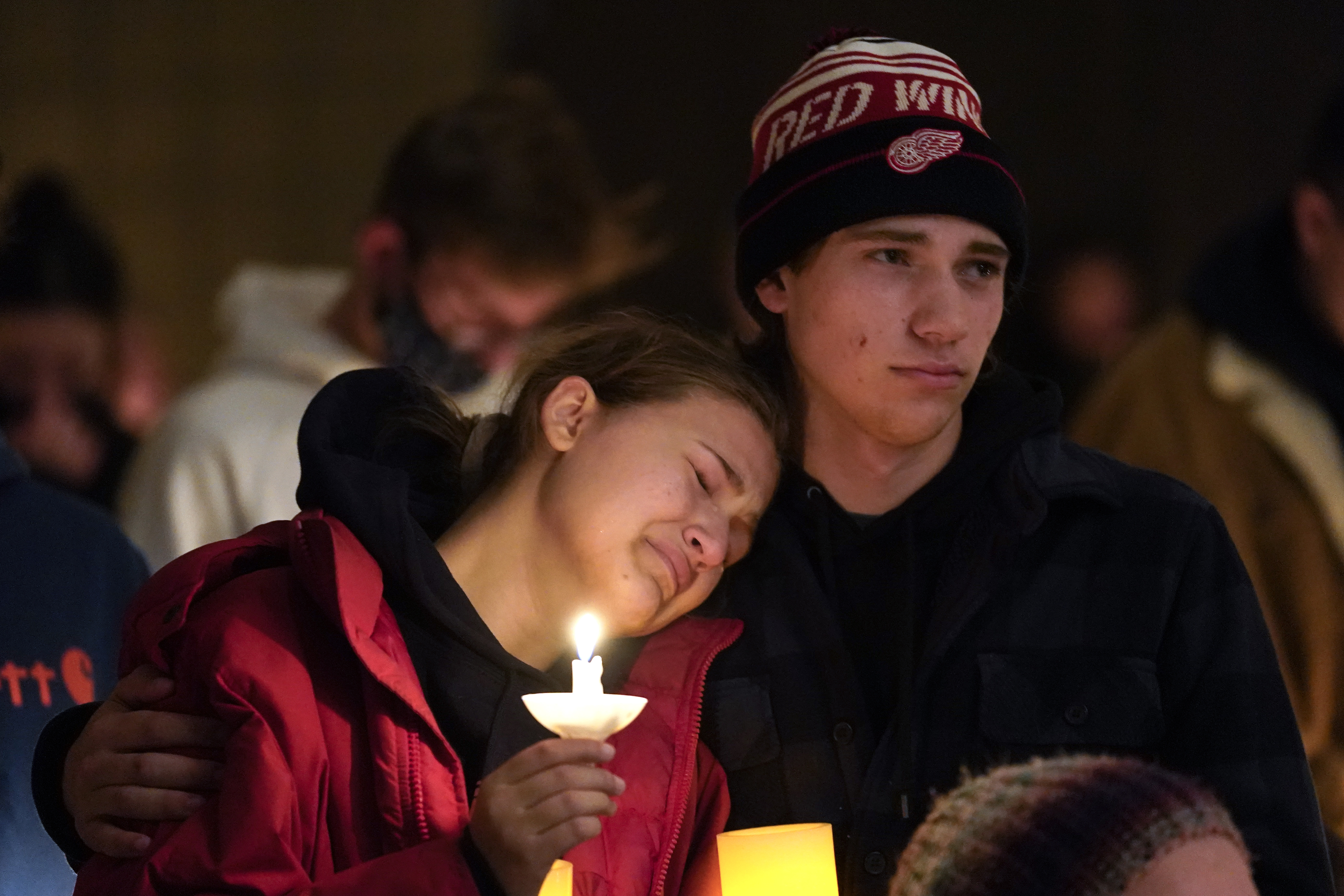 People attending a vigil embrace at LakePoint Community Church in Oxford, Mich., on Tuesday. Authorities say a 15-year-old sophomore opened fire at Oxford High School, killing several students and wounding multiple other people, including a teacher.