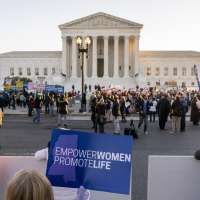 Supreme Court justices signal they'll OK new abortion limits, may toss Roe