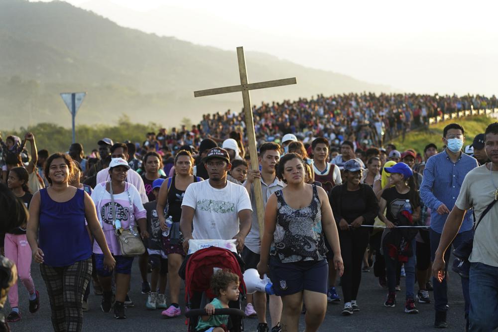 Migrants leave Huixtla, Chiapas state, Mexico, Oct. 27, as they continue their trek north toward Mexico's northern states and the U.S. border. The Biden administration struck an agreement with Mexico to reinstate a Trump-era border policy next week that forces asylum-seekers to wait in Mexico for hearings in U.S. immigration court, U.S. officials said Thursday.
