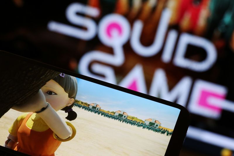 The Netflix series "Squid Game" is played on a mobile phone in this picture illustration taken Sept. 30. More minorities are showing up in mainstream U.S. entertainment, from films and TV to music, as audiences demand stories that reflect the world's diversity, showing that inclusion is good business, industry executives said.