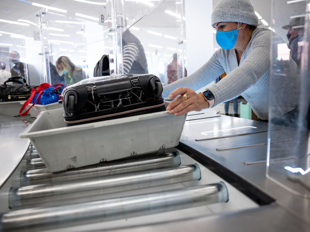 Travelers move through the security checkpoint at Salt Lake City International Airport on Nov. 18. For Utahns, much of President Joe Biden’s new plan to battle COVID-19 variant as the omicron variant of the virus continues to surface in the United States likely will sound familiar.