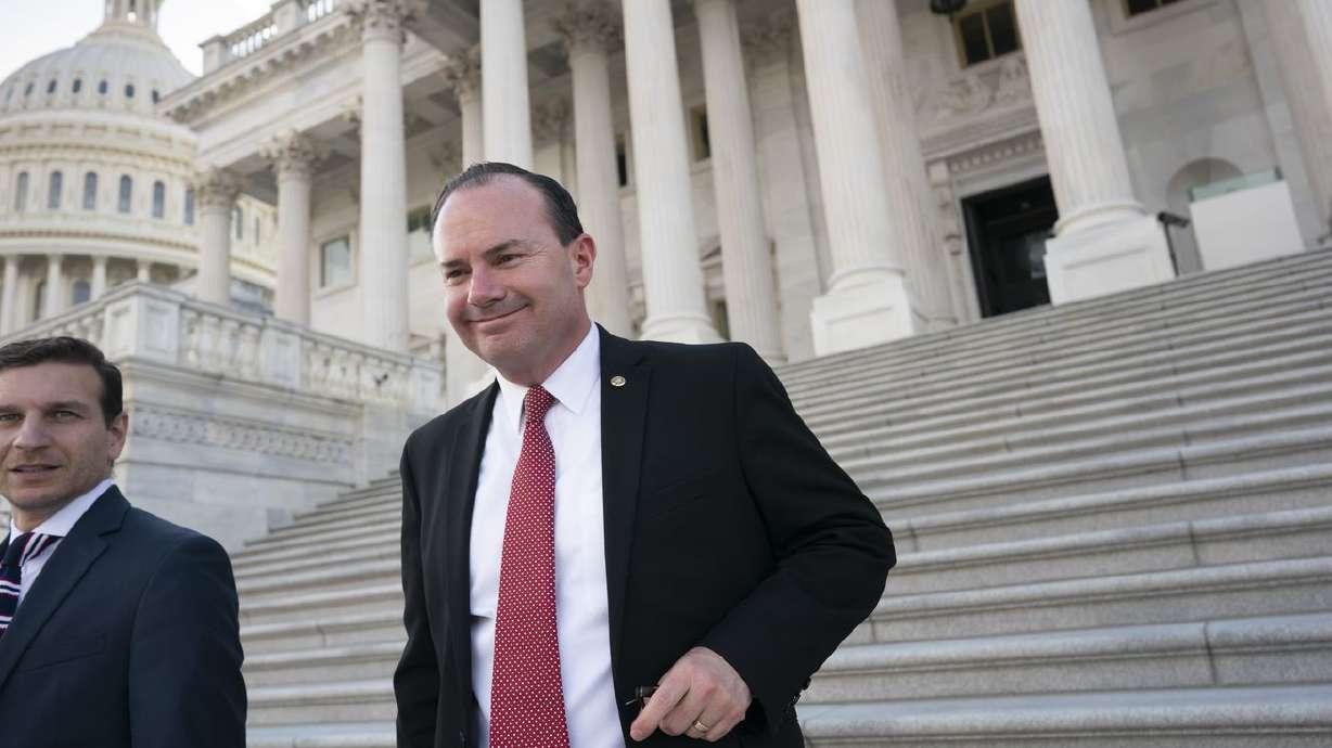 Sen. Mike Lee, R-Utah, right, leaves a private GOP lunch meeting as he continues to press for a vote on his proposal barring vaccine mandates that the Biden administration has
ordered for U.S. companies, at the Capitol in Washington Thursday.