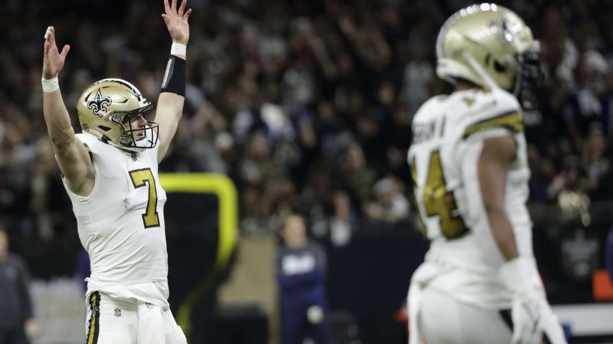 New Orleans Saints quarterback Taysom Hill (7) celebrates a touchdown against the Dallas Cowboys during the first half of an NFL football game, Thursday, Dec. 2, 2021, in New Orleans.