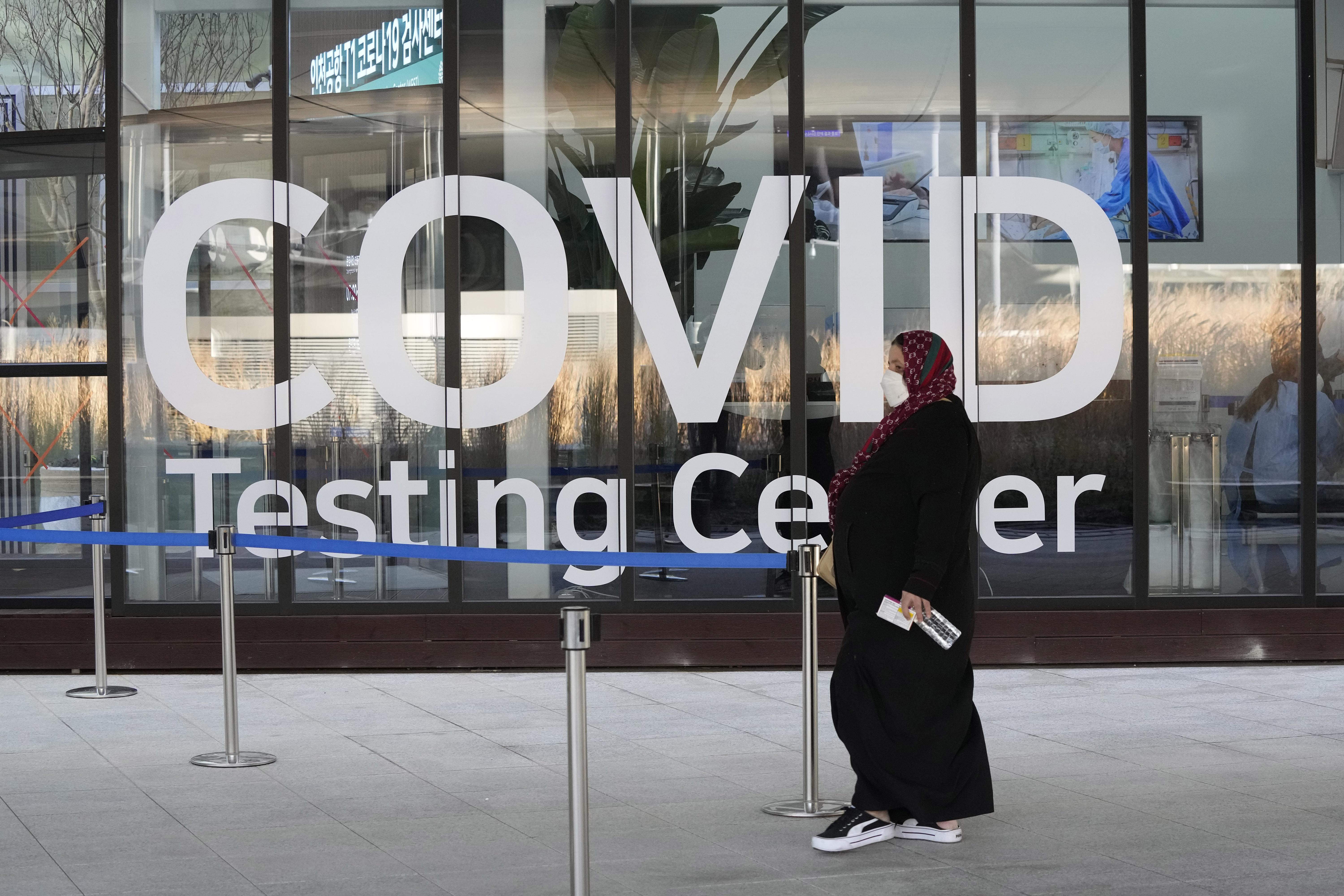 A traveler arrives to enter into a COVID-19 testing center at the Incheon International Airport In Incheon, South Korea, Wednesday. World Health Organization said on Friday that measures used against delta should work against omicron variant.
