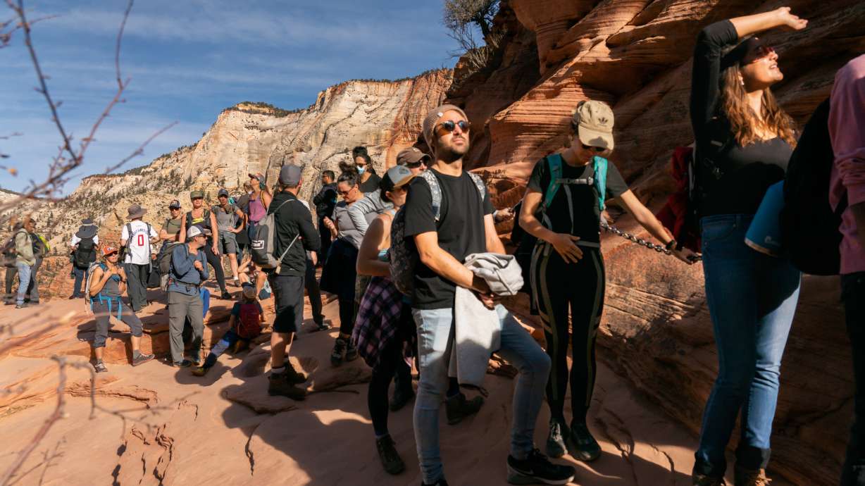 An undated photo of hikers waiting to climb near Angels Landing in Zion National Park. Visitation at the park topped 5 million for the first time ever in 2021, according to data released by the National Park Service late last week.