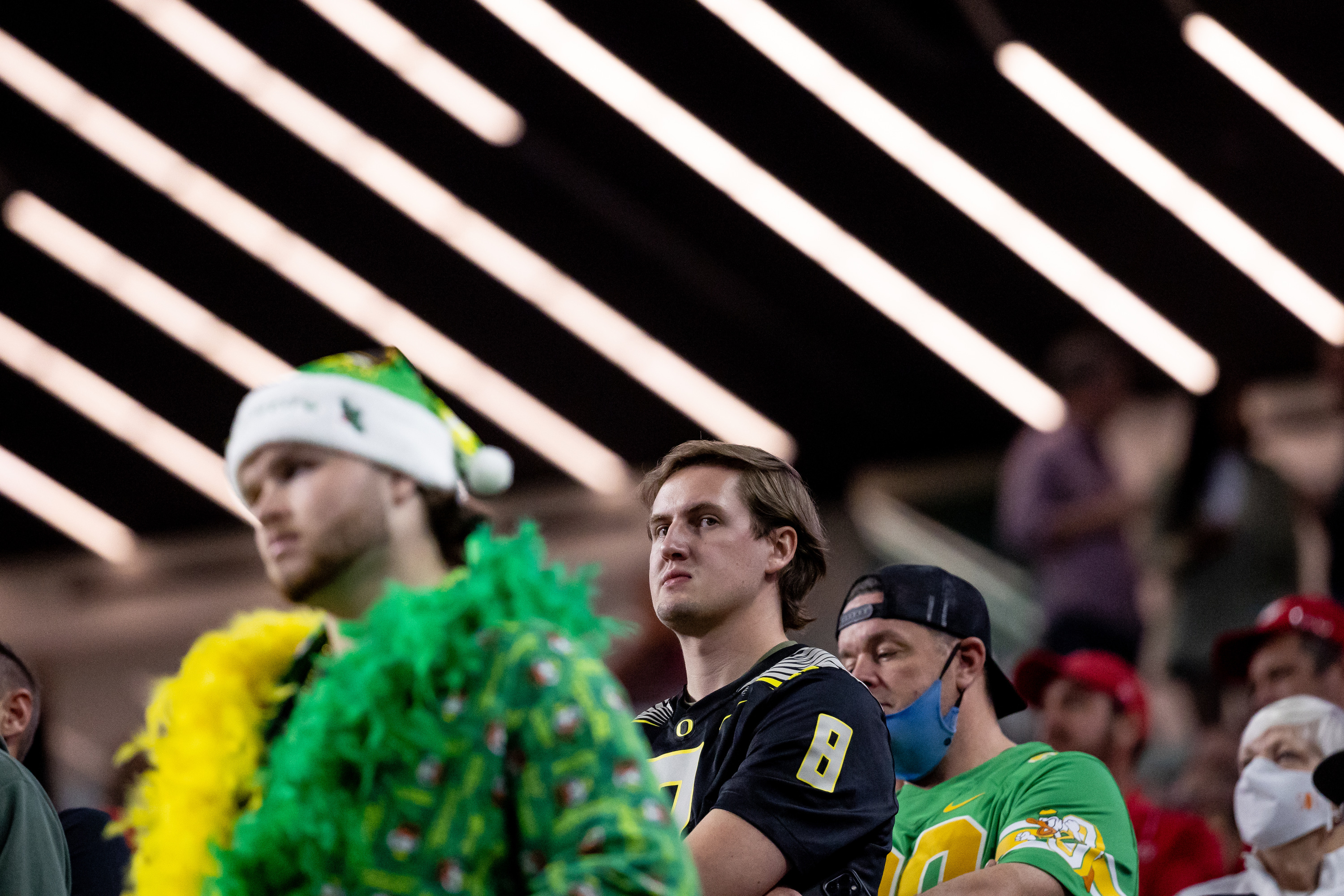 Oregon Ducks fans watch as their team trails the Utah Utes during the Pac-12 championship game at Allegiant Stadium in Las Vegas on Friday, Dec. 3, 2021.