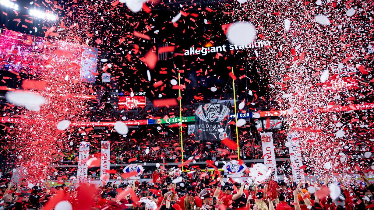 Utah Utes players celebrate after they beat the Oregon Ducks in the Pac-12 championship game at Allegiant Stadium in Las Vegas on Friday, Dec. 3, 2021.