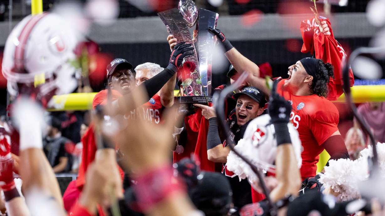 Utah Utes players celebrate after they beat the Oregon Ducks in the Pac-12 championship game at Allegiant Stadium in Las Vegas on Friday, Dec. 3, 2021.