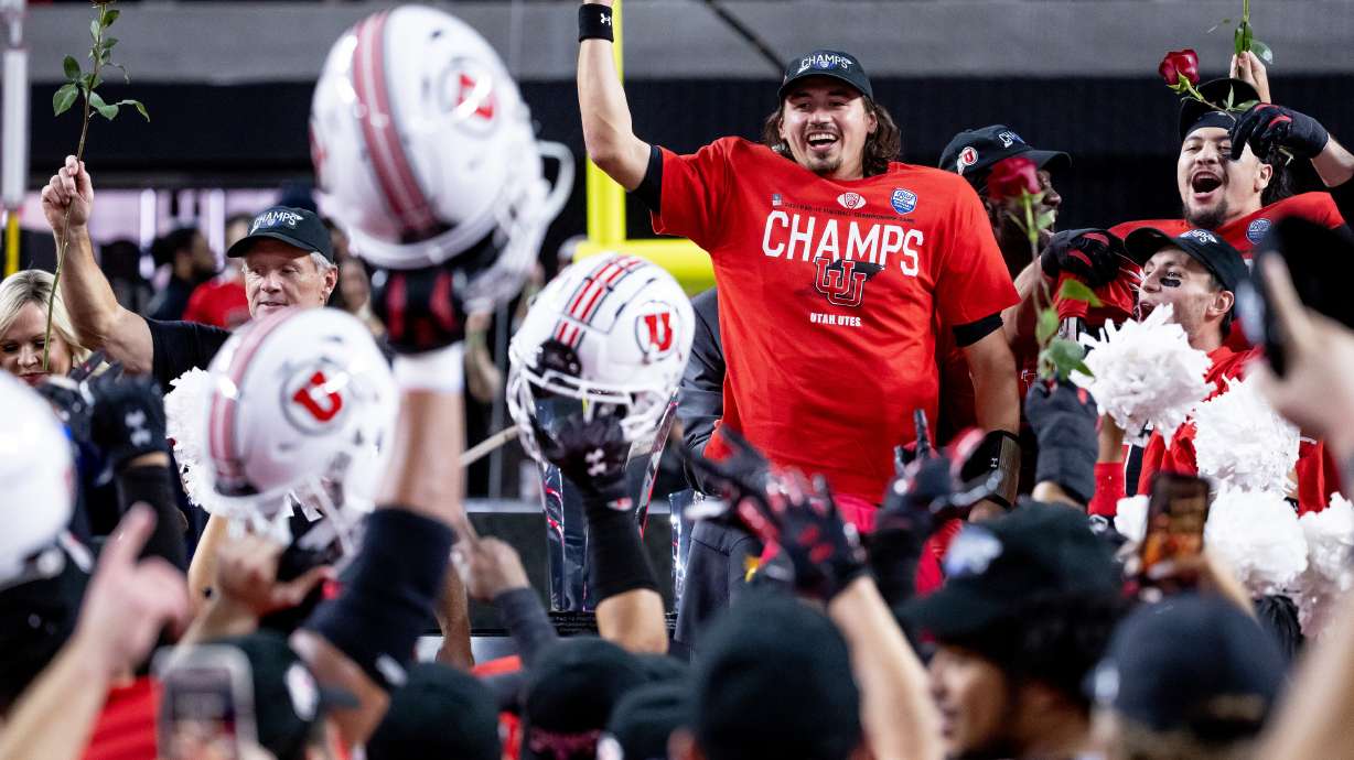 Utah Utes quarterback Cam Rising (7) and teammates celebrate after the Utes beat the Oregon Ducks in the Pac-12 championship game at Allegiant Stadium in Las Vegas on Friday, Dec. 3, 2021.