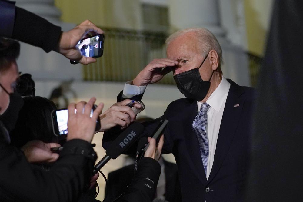 President Joe Biden talks with reporters at the White House in Washington, Friday, as he prepares to leave for Camp David.