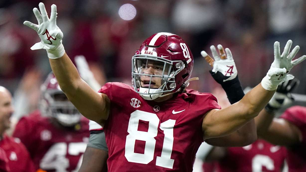Alabama tight end Cameron Latu (81) signals a Georgia fourth down during the second half of the Southeastern Conference championship NCAA college football game, Saturday, Dec. 4, 2021, in Atlanta.