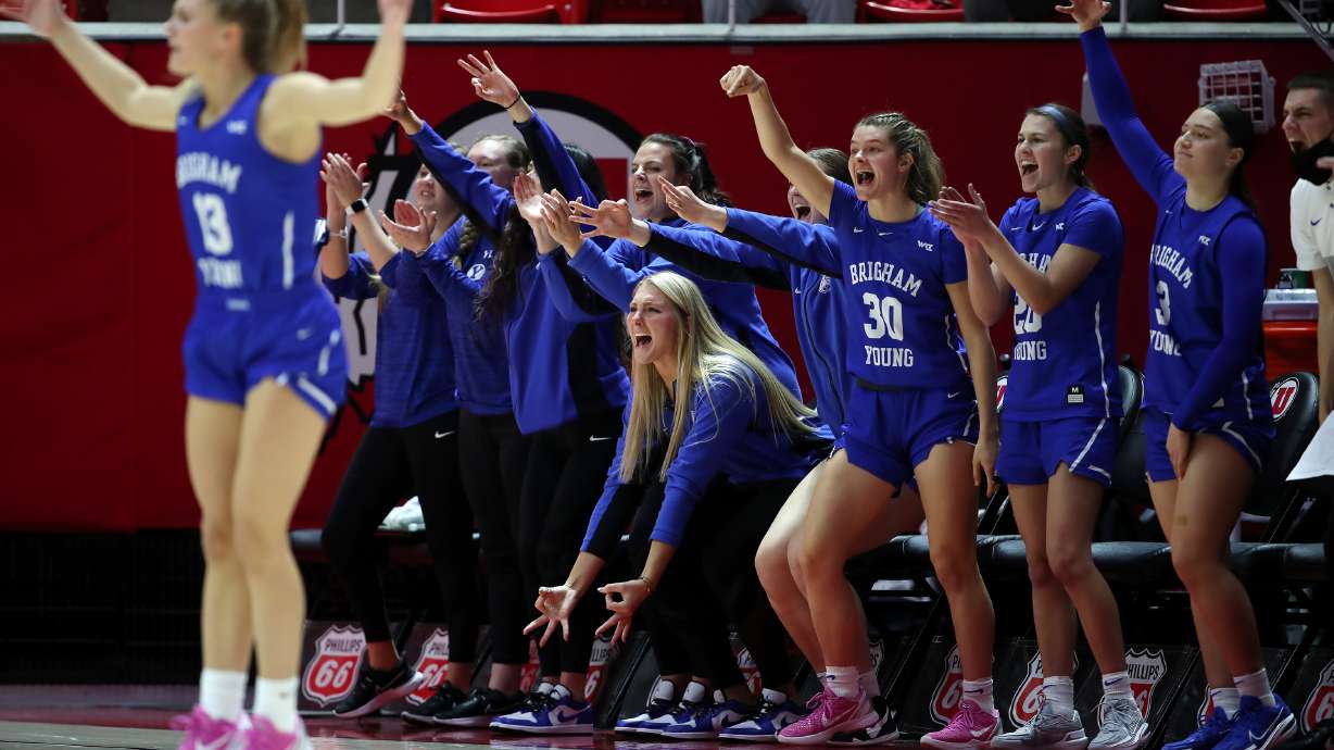 BYU Cougars players react after a three point make as Utah and BYU women compete in a basketball game at the Huntsman Center in Salt Lake City on Saturday, Dec. 4, 2021. BYU won 85-80.