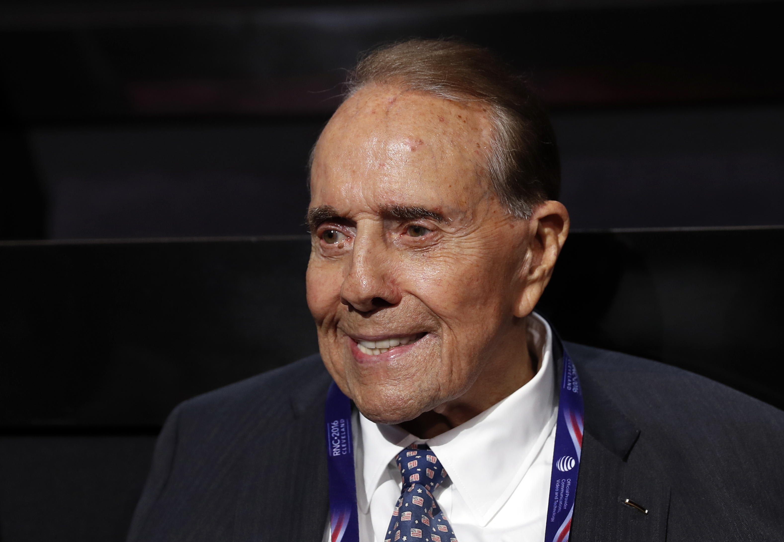 Former Republican presidential candidate Sen. Bob Dole arrives at the Quicken Loans Arena before the evening session of the opening day of the Republican National Convention in Cleveland, Monday, July 18, 2016. Bob Dole, who overcame disabling war wounds to become a sharp-tongued Senate leader from Kansas, a Republican presidential candidate and then a symbol and celebrant of his dwindling generation of World War II veterans, has died.
