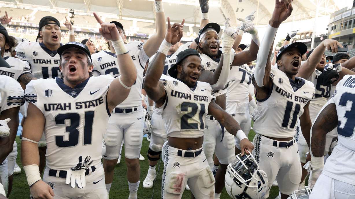 Utah State celebrates after defeating the San Diego State during an NCAA college football game for the Mountain West Conference Championship, Saturday, Dec. 4, 2021, in Carson, Calif.