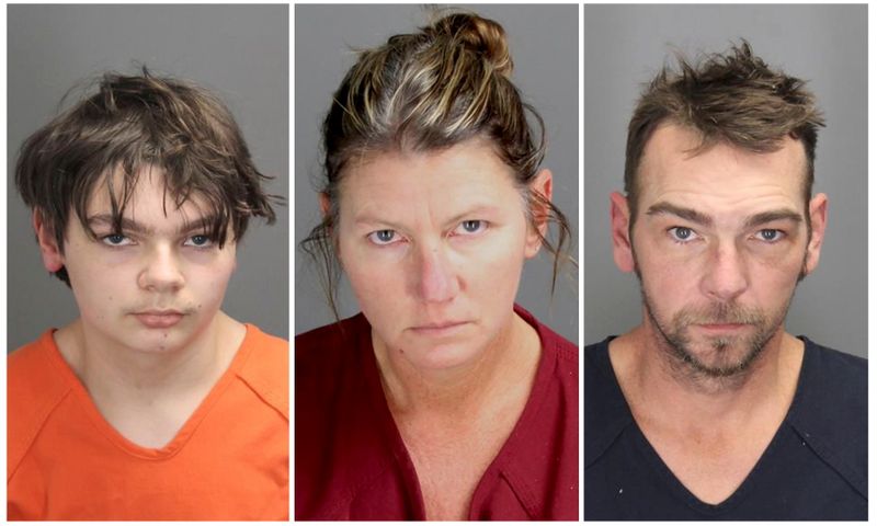Ethan Robert Crumbley, 15, charged with first-degree murder in a high school shooting, poses in a jail booking photograph taken at the Oakland County Jail in Pontiac, Michigan, Dec. 1, in a combination photograph with his parents Jennifer Lynn Crumbley and James Robert Crumbley who were taken into custody Dec. 3.