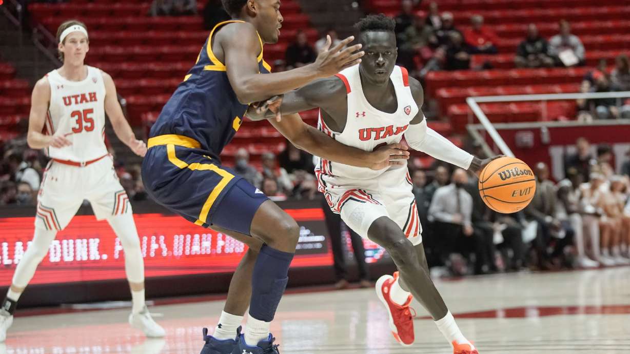 Utah guard Both Gach, right, goes past California guard Jalen Celestine during an NCAA game at the Huntsman Center in Salt Lake City on Sunday, Dec. 5, 2021.