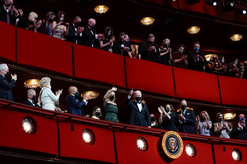 President Joe Biden gestures next to first lady Jill Biden, Vice-President Kamala Harris and second gentleman Doug Emhoff as they attend the 44th Kennedy Center Honors at the John F. Kennedy Center for the Performing Arts in Washington Sunday.