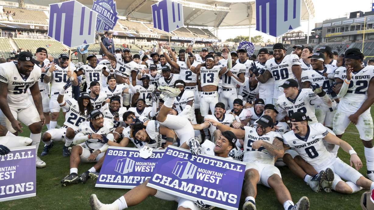 Utah State celebrates after defeating San Diego State during an NCAA college football game for the Mountain West Conference Championship, Saturday, Dec. 4, 2021, in Carson, Calif.