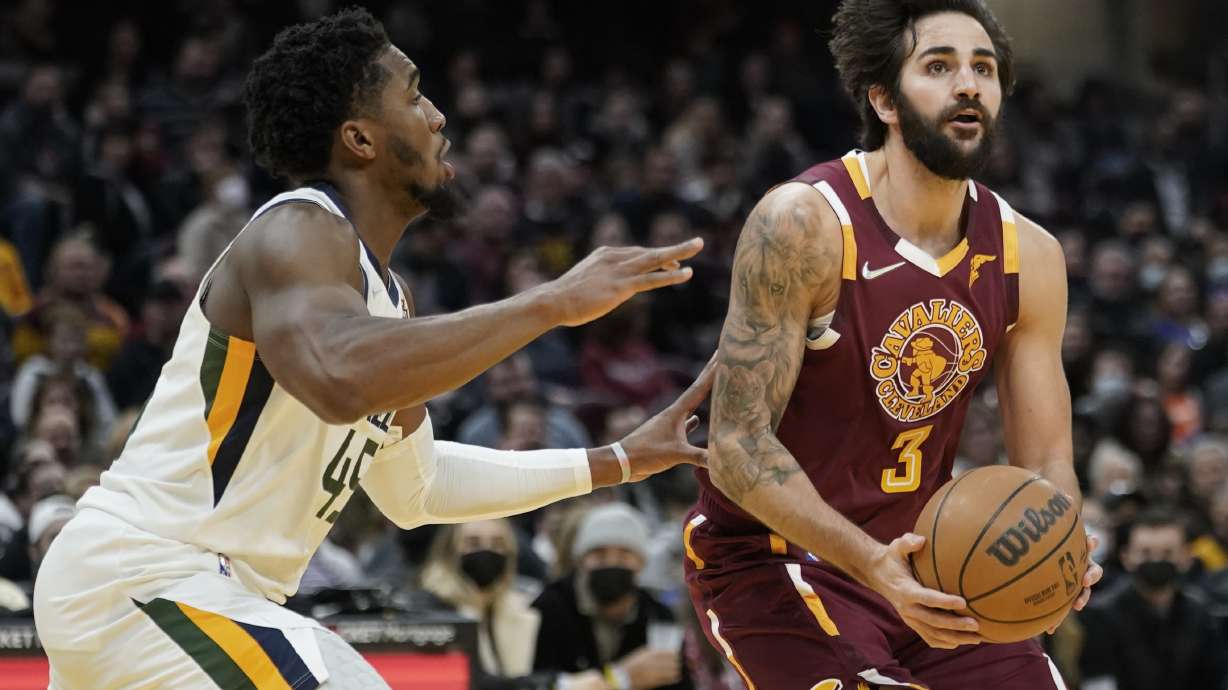 Cleveland Cavaliers' Ricky Rubio (3) drives against Utah Jazz's Donovan Mitchell (45) in the second half of an NBA basketball game, Sunday, Dec. 5, 2021, in Cleveland. Utah won 109-108.