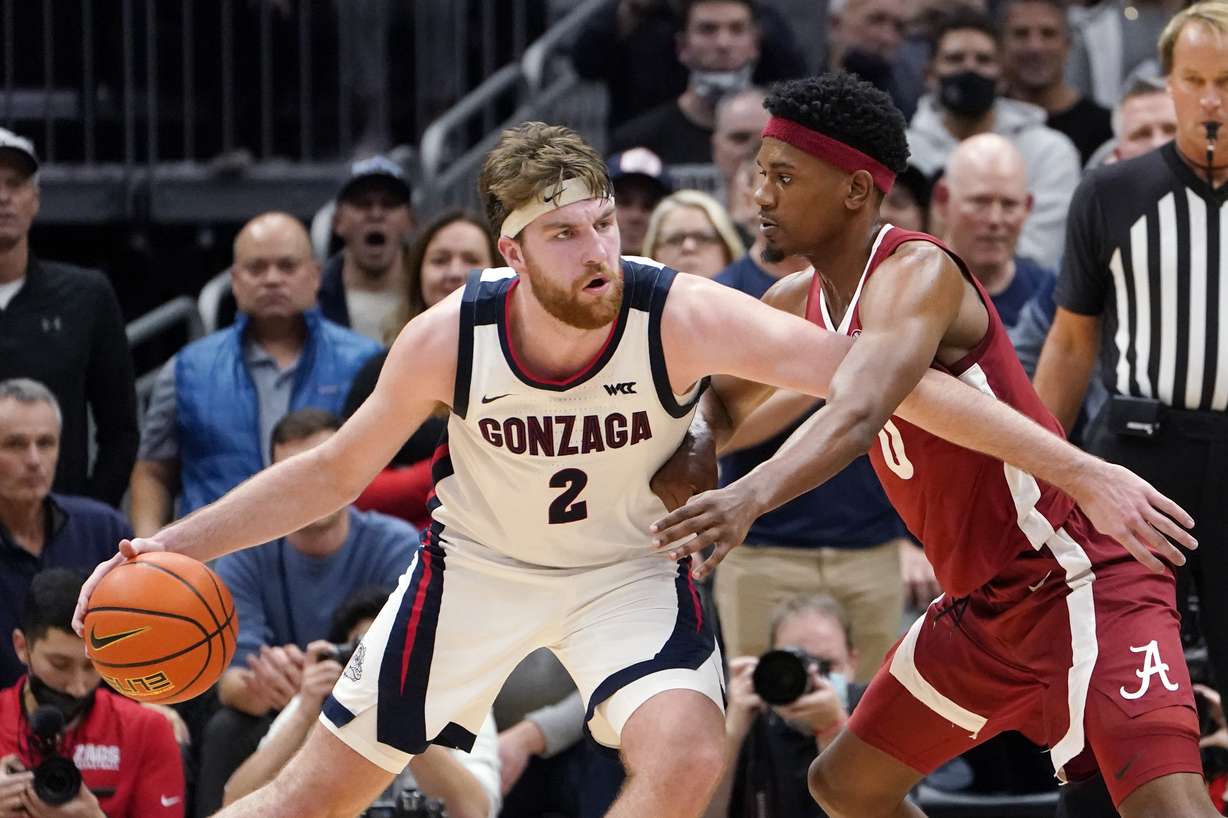 Gonzaga's Drew Timme (2) tries to get past Alabama's Noah Gurley during the second half of an NCAA college basketball game Saturday, Dec. 4, 2021, in Seattle. Alabama won 91-82.