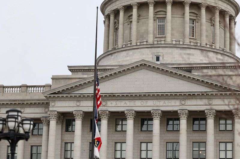The U.S. and Utah state flags fly at half-staff at the
Capitol in Salt Lake City on Monday. Gov. Spencer J. Cox order the flags lowered in honor of the late Sen. Robert Dole, R-Kan., who died Sunday.
