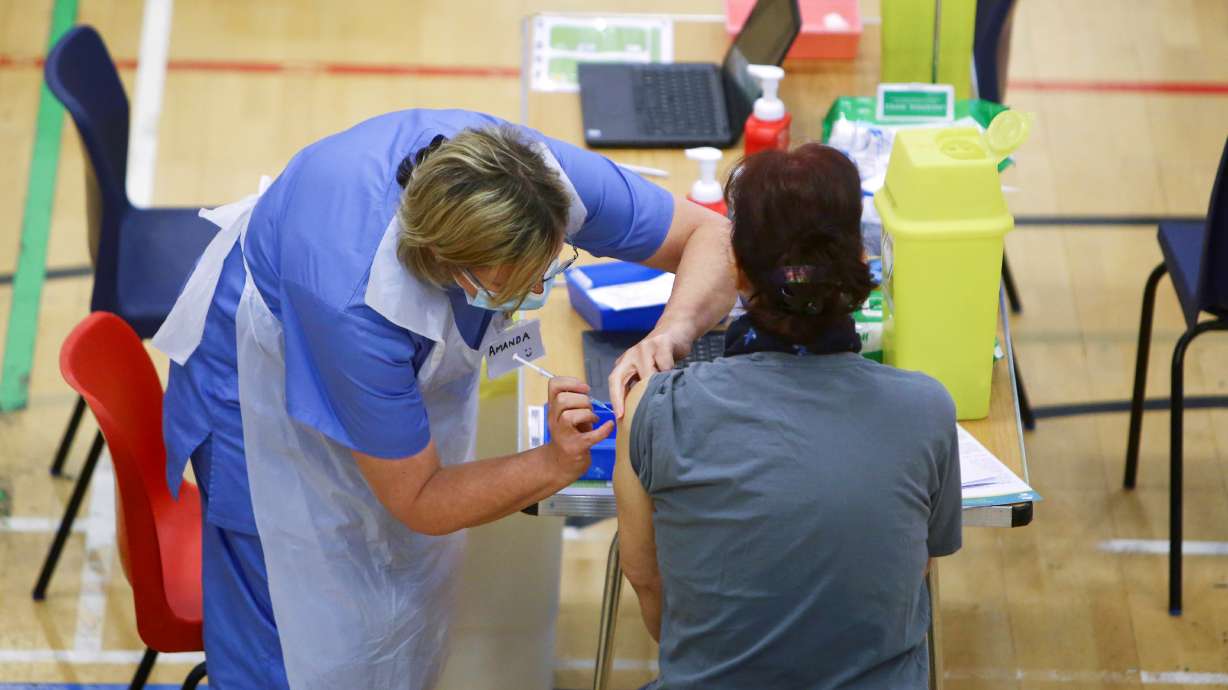 A woman receives an Oxford-AstraZeneca coronavirus disease vaccine at a COVID-19 vaccination centre at Cwmbran Stadium in Cwmbran, South Wales, Britain Feb. 17. A professor of vaccinology says next pandemic could be more lethal than COVID-19.