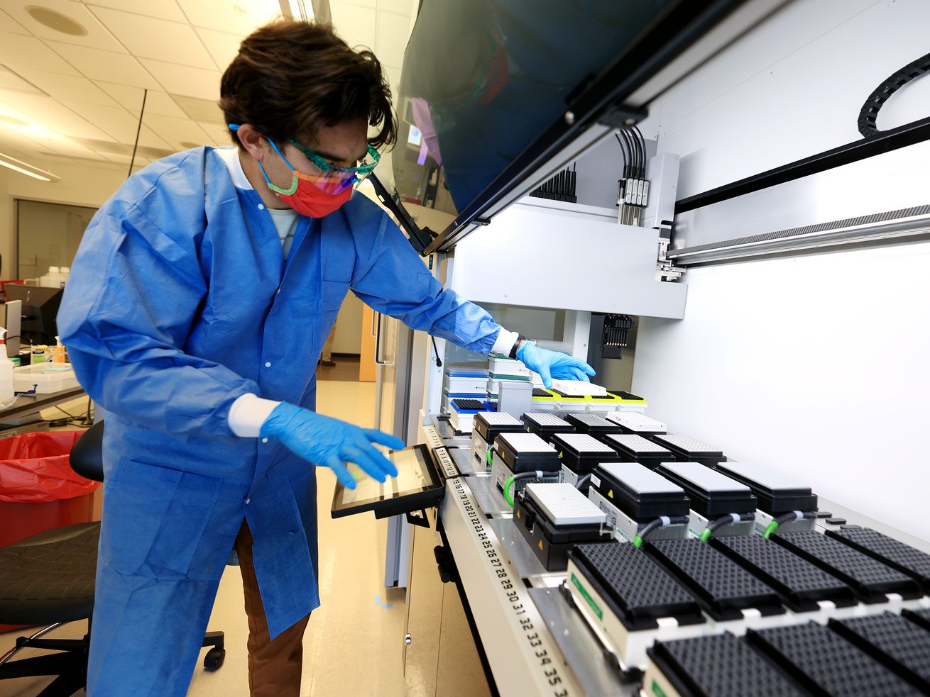 Microbiologist Samuel Philips sequences COVID-19 samples for variants at the Utah Public Health Laboratory in Taylorsville on Nov. 29. A Utah doctor said Thursday that higher case counts show that Utah is experiencing another holiday surge.