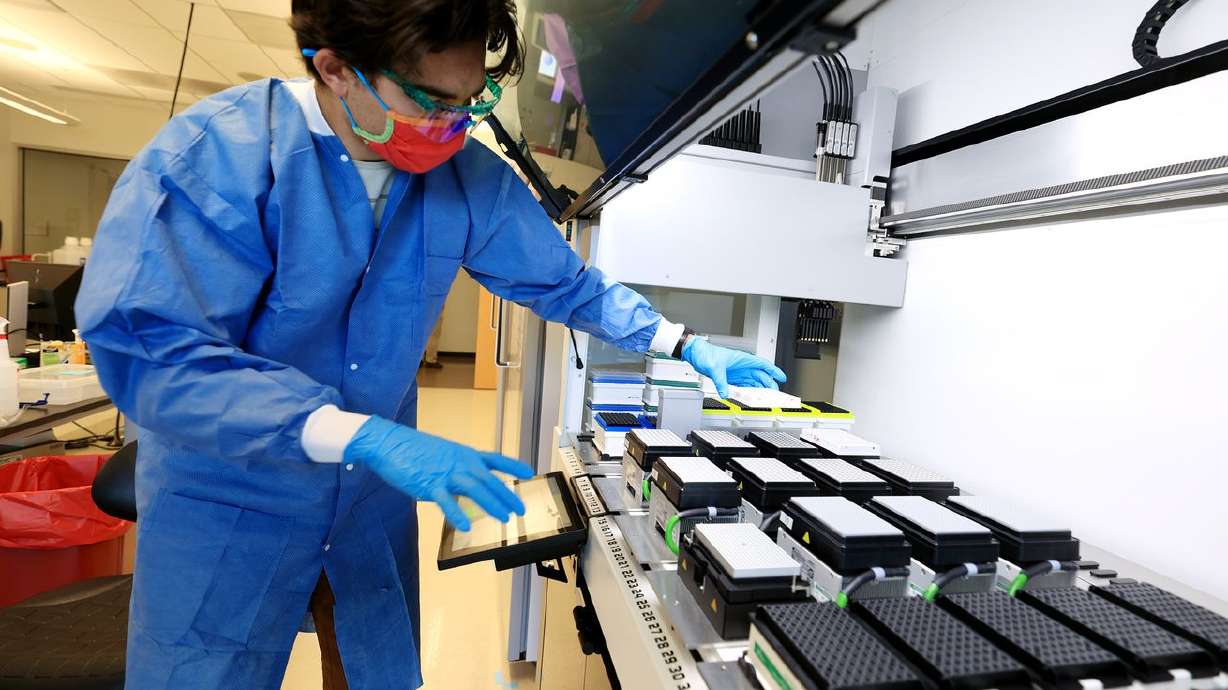 Microbiologist Samuel Philips sequences COVID-19 samples for variants at the Utah Public Health Laboratory in Taylorsville on Nov. 29. A Utah doctor said Thursday that higher case counts show that Utah is experiencing another holiday surge.