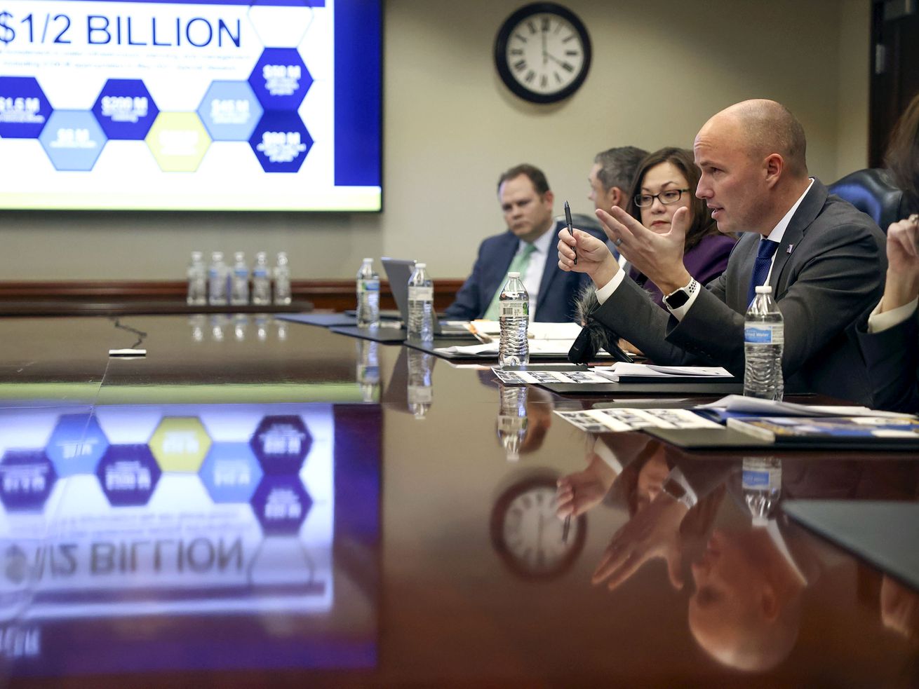 Gov. Spencer Cox, right, talks about state budget recommendations with the KSL and Deseret News editorial boards at the Deseret News office in the Triad Center in Salt Lake City on
Monday.