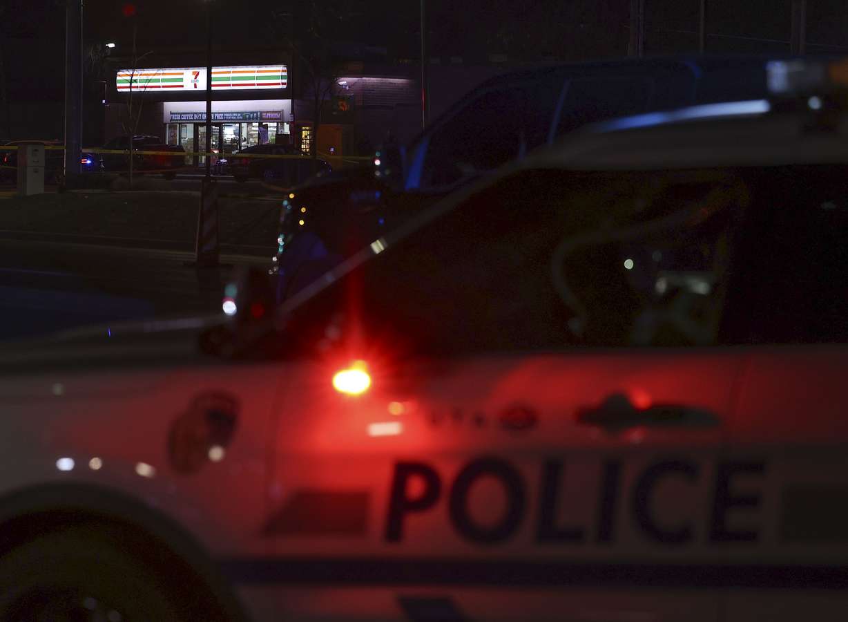 Crime tape and a heavy police presence surround a 7-11 in Taylorsville on Dec. 1. Two police officers and Anei Joker were shot while exchanging gunfire at 4110 S. Redwood. Joker later died from his injuries.