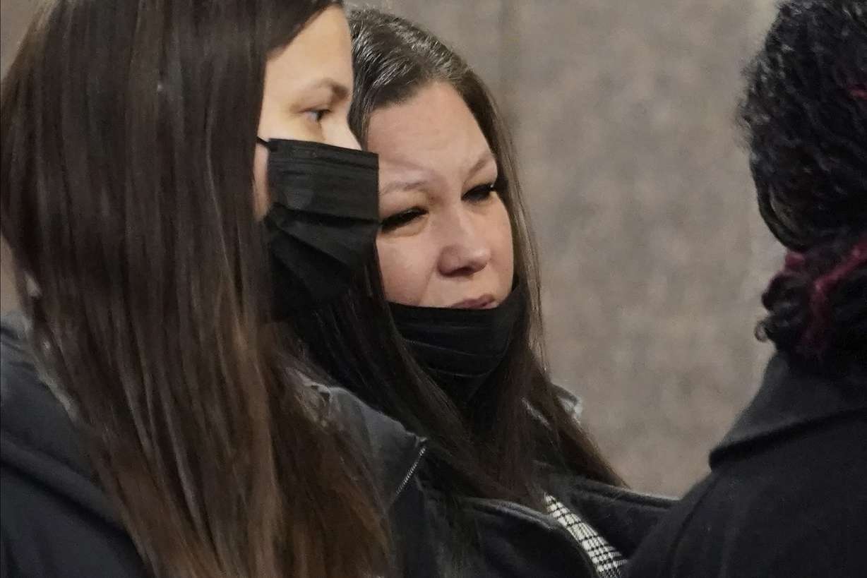 Katie Wright, the mother of Daunte Wright, center, waits in line to go through security with family members as they arrive Dec. 1 at the Hennepin County Government Center in Minneapolis.