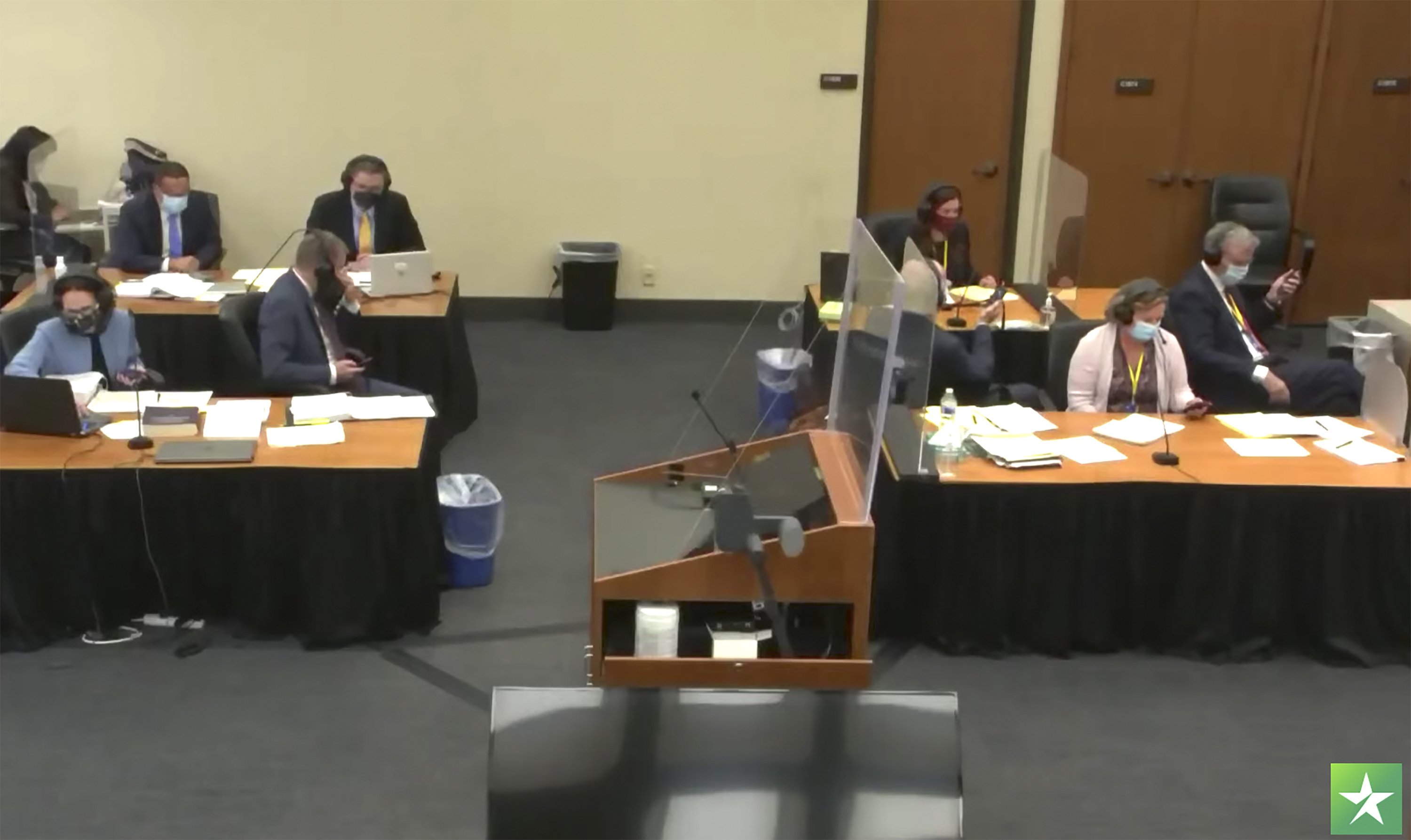 Former Brooklyn Center police officer Kim Potter sits at the defense table, right, as the prosecution, left, and the defense right, participate in a sidebar with Hennepin County Judge Regina Chu on Nov. 30. Opening statements at Potter's manslaughter trial get underway Wednesday.